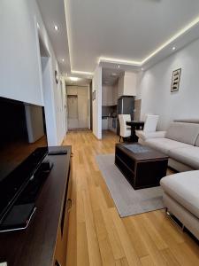 a living room with a couch and a table at DRAGAm in Banja Luka