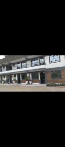 a large building with windows on the side of it at Weber Generations Accommodation -R & R Cozy Homes in Naivasha