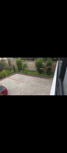 a view of a courtyard with a tennis court at Weber Generations Accommodation -R & R Cozy Homes in Naivasha +1 photo
