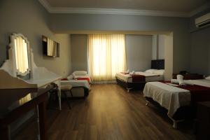 Postel nebo postele na pokoji v ubytování BALŞEN HOTEL