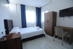Postel nebo postele na pokoji v ubytování BALŞEN HOTEL