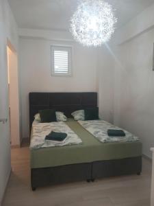 Posteľ alebo postele v izbe v ubytovaní Apartman Marita