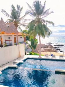 Bazén v ubytování Simple Life Talay & Divers Resort nebo v jeho okolí