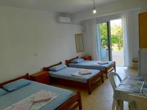 Postel nebo postele na pokoji v ubytování Spiro Guest House