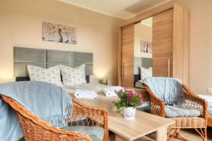 a bedroom with a bed and a table and chairs at Zbójnicka Chata in Duszniki Zdrój +84 photos