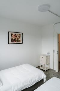 Postel nebo postele na pokoji v ubytování De Logé