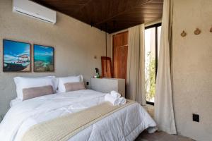 Cama ou camas em um quarto em Natu Boutique Stays