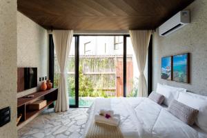 Cama ou camas em um quarto em Natu Boutique Stays