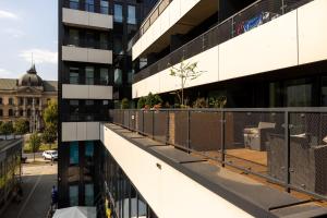 an external view of a building with a balcony at White Marble in Black Pearl Chic City Centre in Szczecin