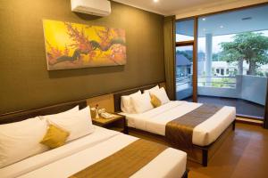 Katil atau katil-katil dalam bilik di Samara Resort