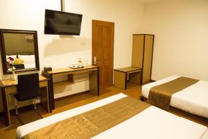 Katil atau katil-katil dalam bilik di Samara Resort