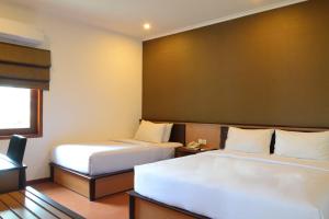 Katil atau katil-katil dalam bilik di Samara Resort