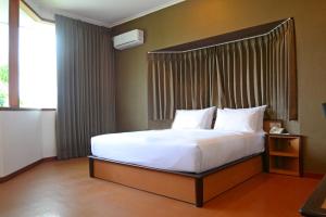 Katil atau katil-katil dalam bilik di Samara Resort