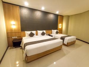 Katil atau katil-katil dalam bilik di Samara Resort