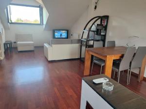 a living room with a couch and a table at Un posto tranquillo a Milano in Milan