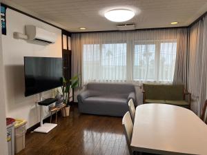 Een TV en/of entertainmentcenter bij Marina Bay Atami
