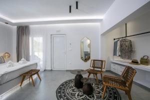 Ένα ή περισσότερα κρεβάτια σε δωμάτιο στο Calma Luxury Studios & Suites
