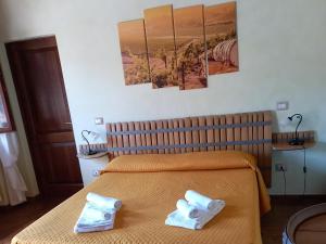 A bed or beds in a room at Agriturismo Il Borghetto