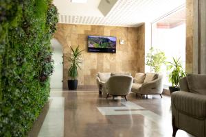 TV a/nebo společenská místnost v ubytování Richmind Hotel