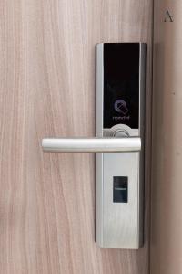 a door opener with a ipod on a wall at Maia Apartment with One Bedroom & Fully kitchen in Bucharest
