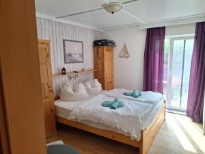 Postel nebo postele na pokoji v ubytování Pension zum Meer