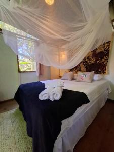 Postel nebo postele na pokoji v ubytování YbYmara Eco Glamping