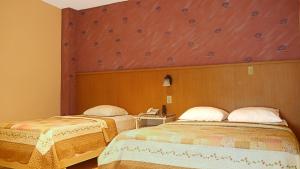 Rúm í herbergi á Hotel Castilla