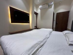 Voodi või voodid majutusasutuse Mahant Ji Residency toas