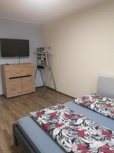 Posteľ alebo postele v izbe v ubytovaní Tp Apartman