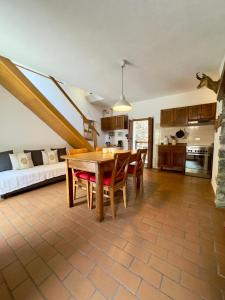 a kitchen with a table and chairs in a room at Casa Antonietta in Domaso +5 photos