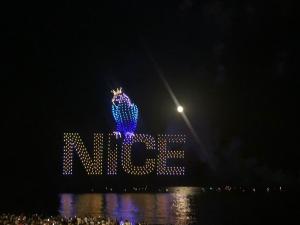 a lit up mike sign at night at Le Fontana in Nice