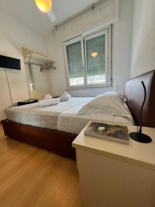 Postel nebo postele na pokoji v ubytování Hotel Locanda Castagnola
