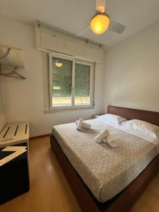 Postel nebo postele na pokoji v ubytování Hotel Locanda Castagnola