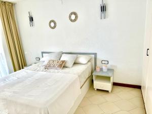 Ένα ή περισσότερα κρεβάτια σε δωμάτιο στο Apartamento Playa Salou +9 φωτογραφίες