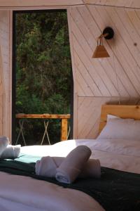 Cama o camas de una habitación en Glamping EmeralD