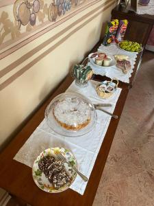a table with several plates of food on it at Casa Vacanze Pirulla in Sala Monferrato +23 photos
