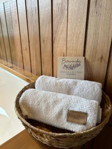 a basket filled with towels on top of a table at Suite del muelle in San Carlos de Bariloche