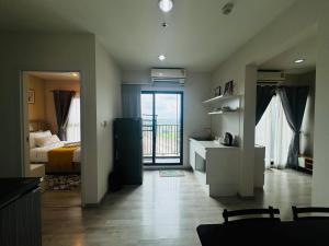 Voodi või voodid majutusasutuse Minimal 2 BR next to IKEA, Central Westgate Bangyai toas