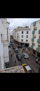 a view of a city street with cars and buildings at Appartement Esmeralda in Tétouan