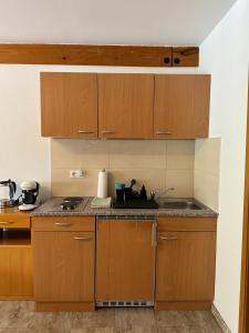 Η κουζίνα ή μικρή κουζίνα στο Gemütliches Studio mit Balkon +3 φωτογραφίες