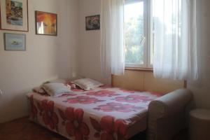Posteľ alebo postele v izbe v ubytovaní Apartment Vita