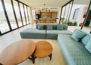 a living room with two couches and a table at Villa Nha Trang Gần Biển - Biệt Thự Nha Trang Gần Biển in Nha Trang