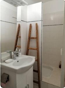 a bathroom with a sink and a ladder next to a shower at La retapée in Quinson +20 photos