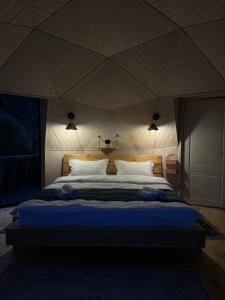 Cama o camas de una habitación en Glamping EmeralD