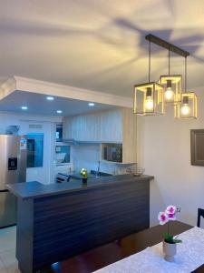 Kuchyň nebo kuchyňský kout v ubytování Refugio de Aves Bienvenido a tu hogar en Pucón + 18 fotografií