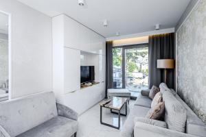 TV a/nebo společenská místnost v ubytování Balticus Apartamenty Standard Promenada Gwiazd 14