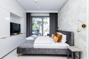 Łóżko lub łóżka w pokoju w obiekcie Balticus Apartamenty Standard Promenada Gwiazd 14