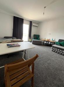 a living room with a couch and a table at Cyprus Chill Apartment in İskele
