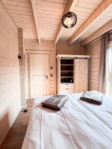 En eller flere senge i et værelse på Hercynia Lodge