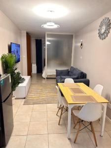 TV a/nebo společenská místnost v ubytování Residence Next Door Coral 1